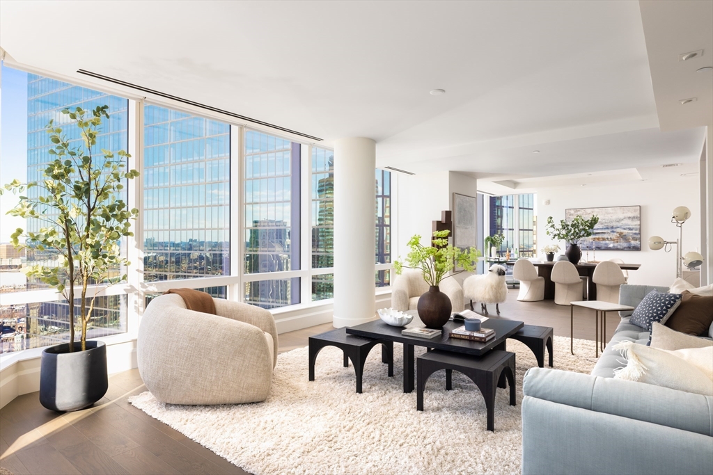40 Trinity Place, Unit 23C Boston, MA 02116 - Photo 1 of 41 a living room with furniture and floor to ceiling windows