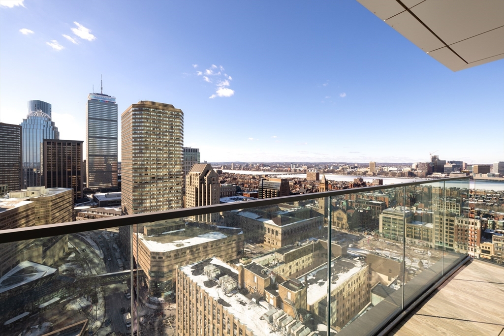 40 Trinity Place, Unit 23C Boston, MA 02116 - Photo 18 of 41 a view of a city skyline from a balcony