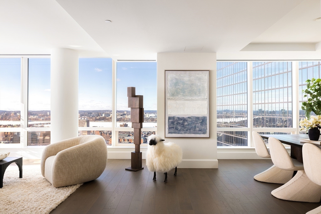 40 Trinity Place, Unit 23C Boston, MA 02116 - Photo 4 of 41 a living room with furniture and a large window
