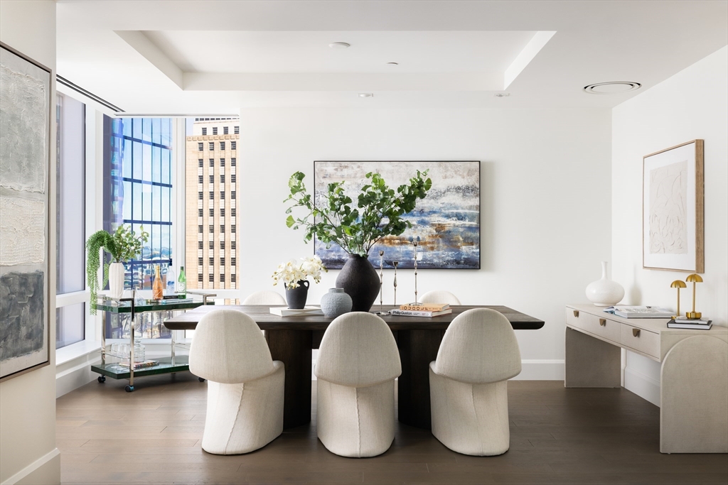 40 Trinity Place, Unit 23C Boston, MA 02116 - Photo 5 of 41 a view of a dining room with furniture and a large window