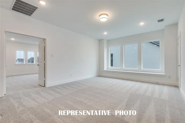 a bathroom with a tub shower and window