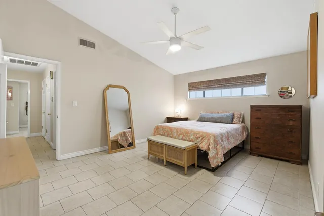 a bathroom with a sink vanity mirror and toilet