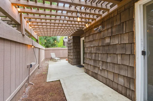 a swimming pool with outdoor seating and yard
