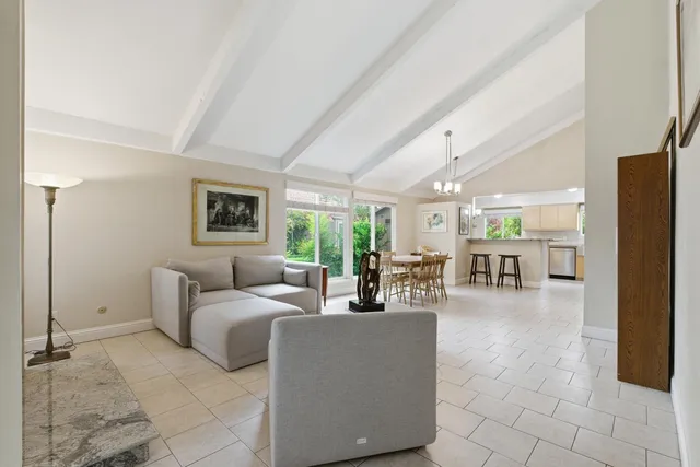 a kitchen with granite countertop a refrigerator and a stove