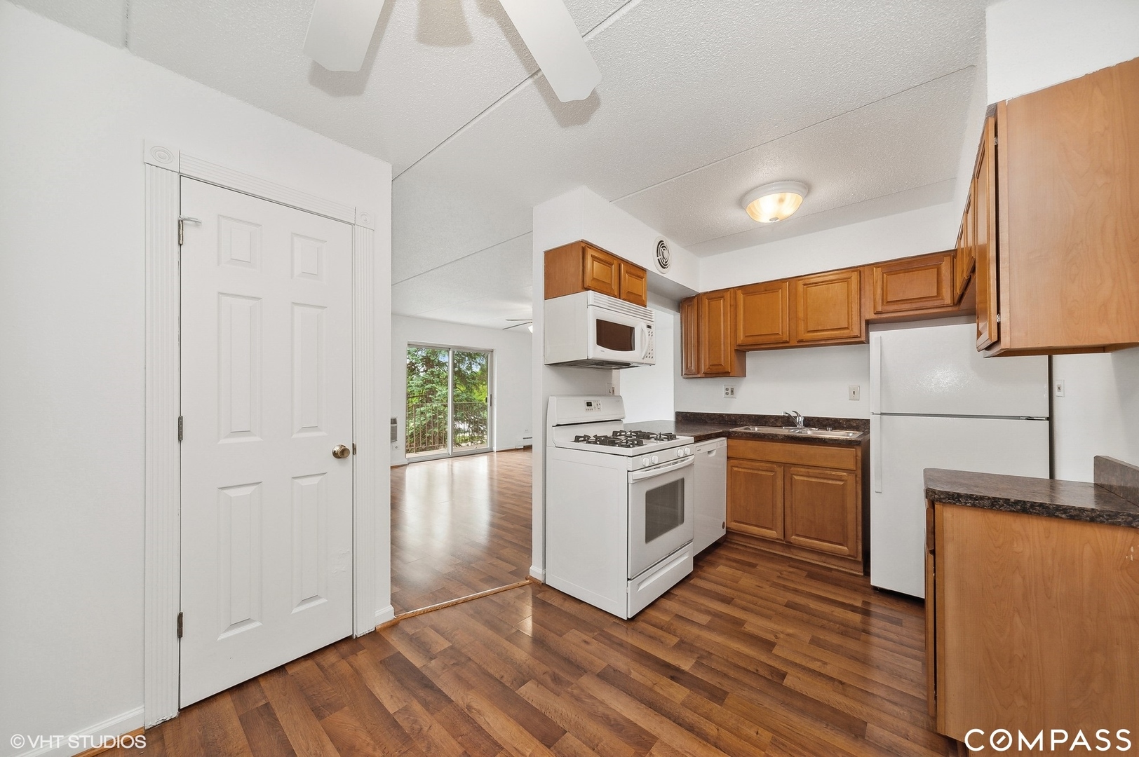 575 Fairway View Drive, Unit 2F Wheeling, IL 60090 - Photo 5 of 14 a kitchen with stainless steel appliances granite countertop a stove a sink and a refrigerator