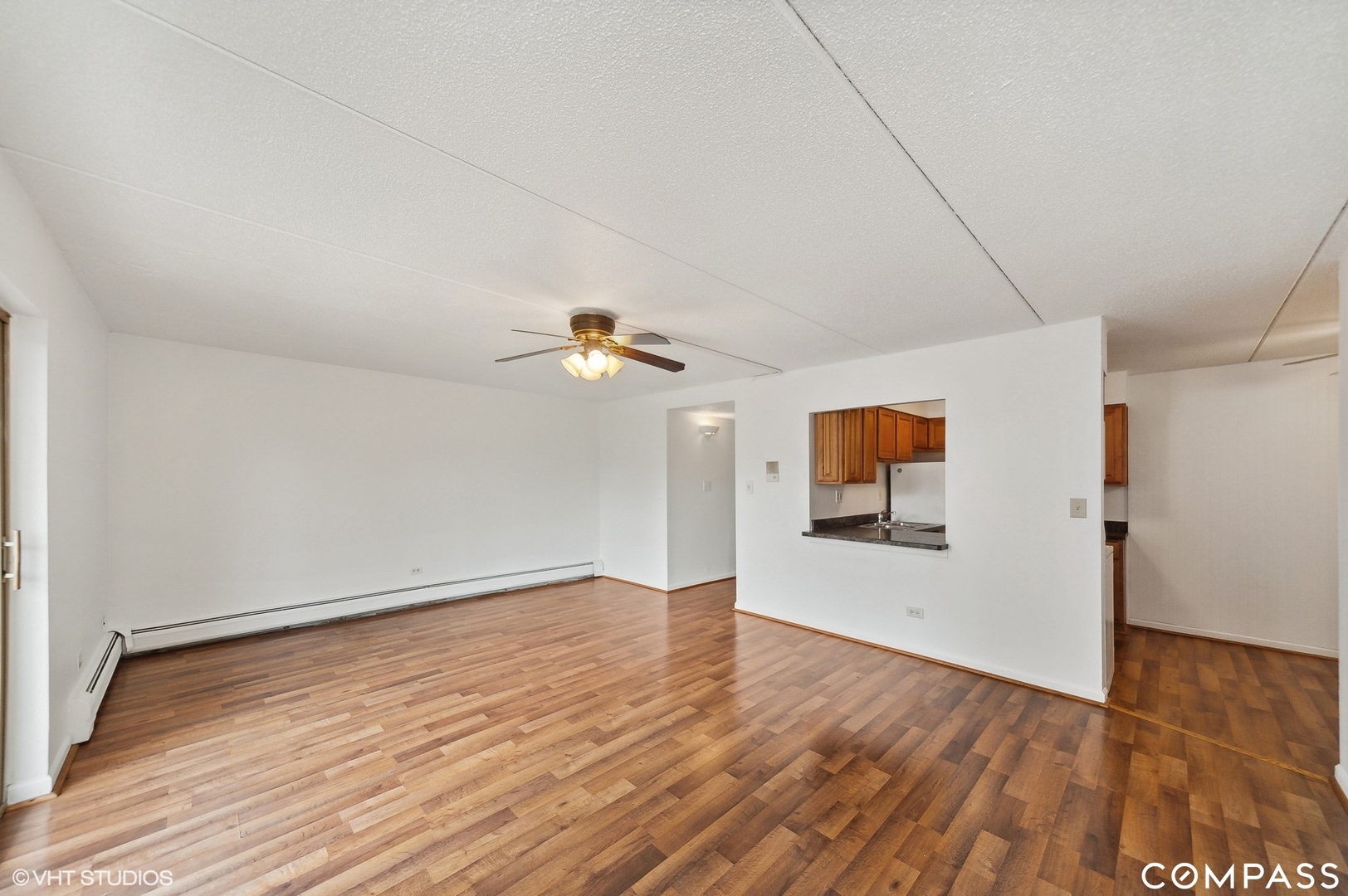 575 Fairway View Drive, Unit 2F Wheeling, IL 60090 - Photo 7 of 14 wooden floor in an empty room with a window