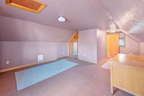 a view of a livingroom with a ceiling fan and window