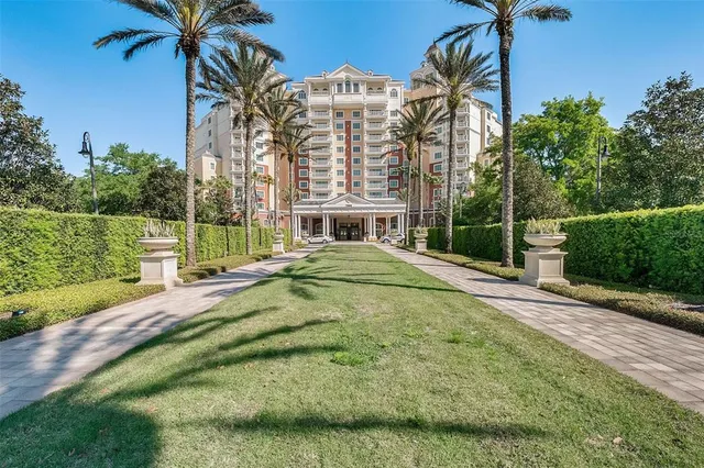 a view of swimming pool with a garden and trees
