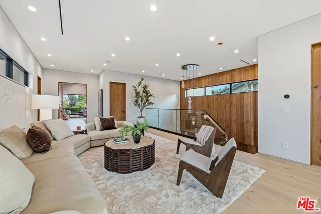 a bedroom with a bed window and couch