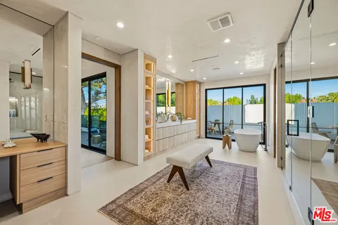 a bathroom with a glass shower door and a bathtub