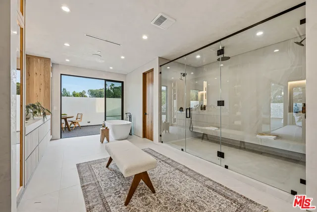 a view of a livingroom with furniture and staircase