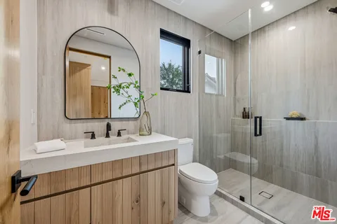 a bedroom with a large bed and a couch