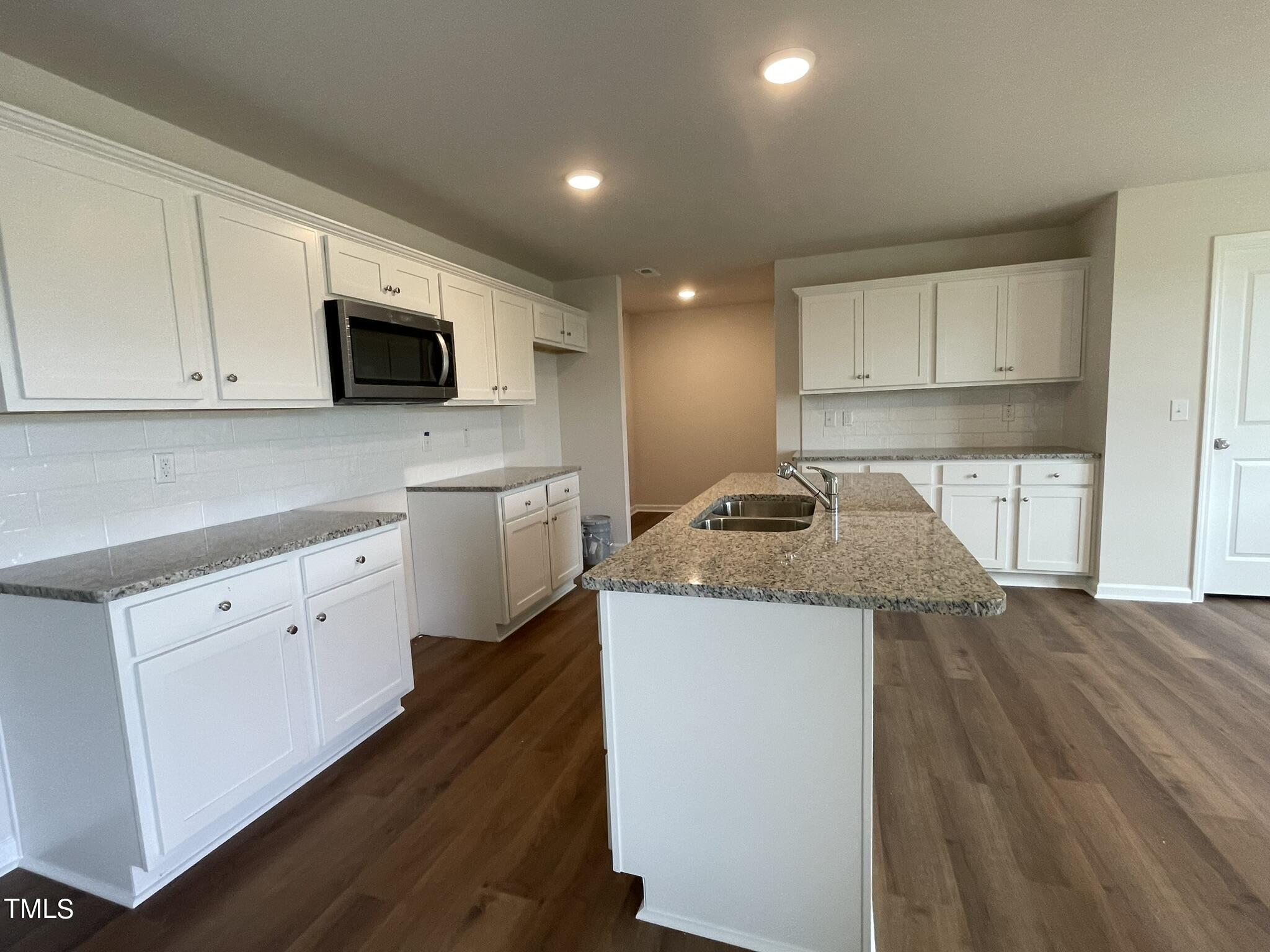 170 Grace Ridge Benson, NC 27504 - Photo 4 of 18 a kitchen with a sink a microwave and cabinets