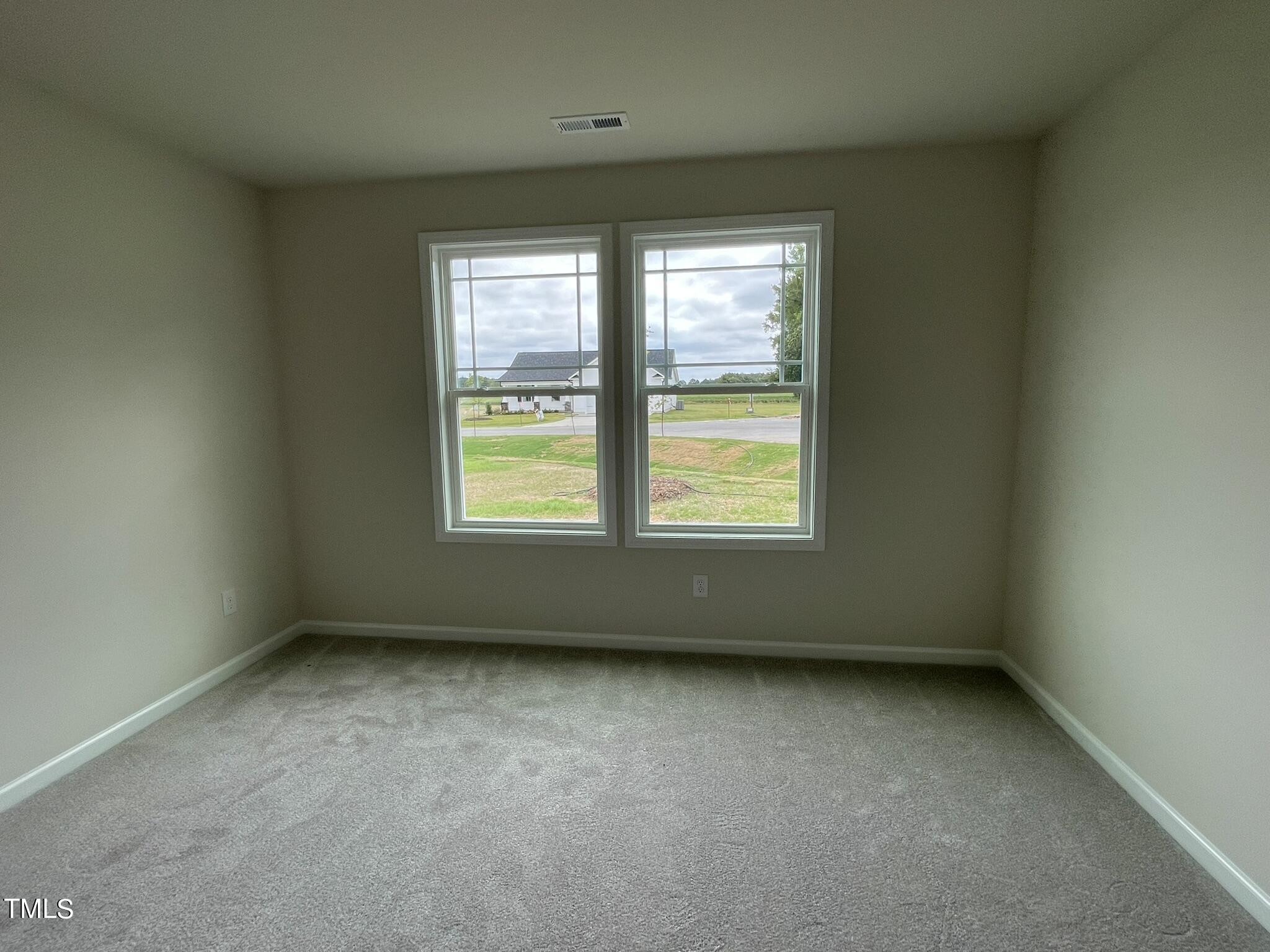 170 Grace Ridge Benson, NC 27504 - Photo 10 of 18 an empty room with a window