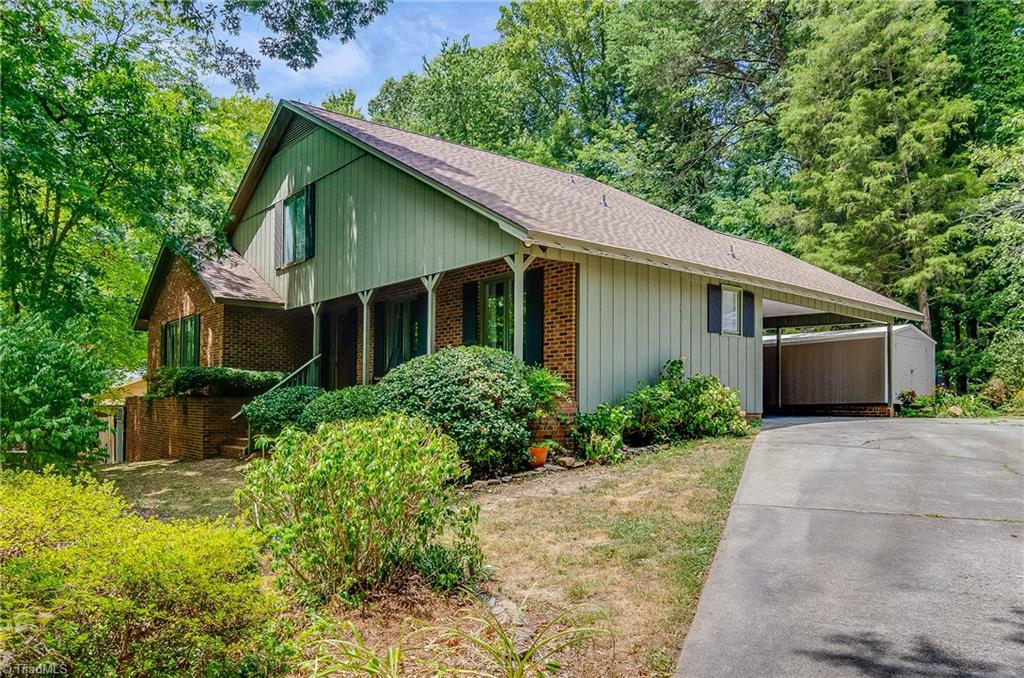 3105 Rolling Road High Point, NC 27265 - Photo 2 of 30 Side view of home. Roof done in 2017.