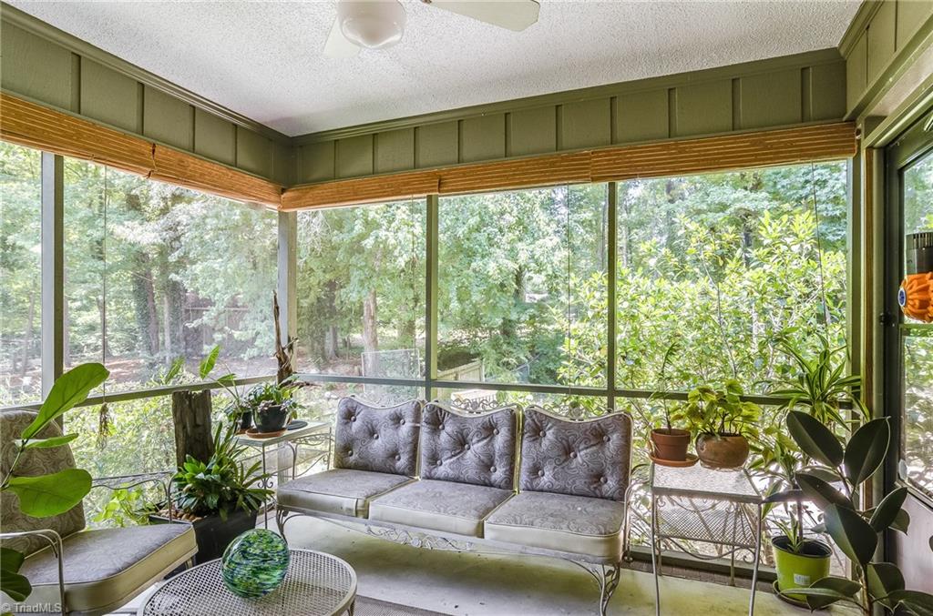 3105 Rolling Road High Point, NC 27265 - Photo 11 of 30 Screened porch is the perfect spot to relax. Ceiling fan adds that extra breezy feeling.