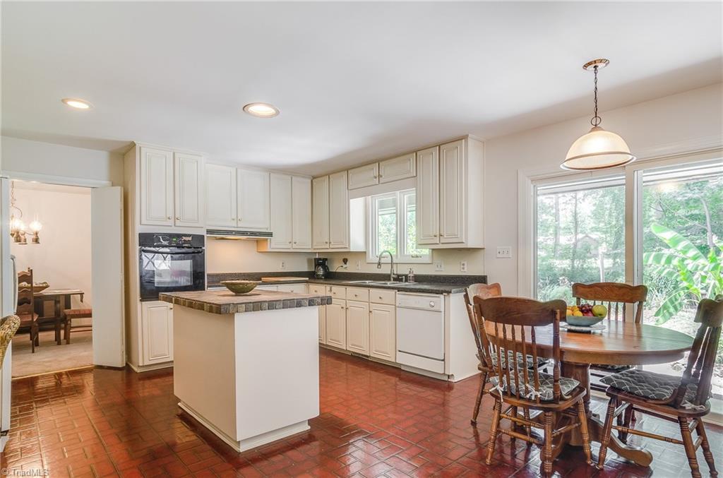 3105 Rolling Road High Point, NC 27265 - Photo 12 of 30 Large kitchen with eat-in kitchen. Sliding glass doors lead to backyard.