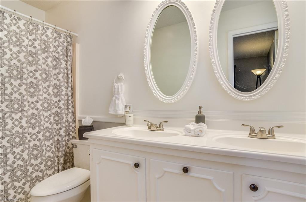 3105 Rolling Road High Point, NC 27265 - Photo 20 of 30 Ensuite master bath with double sink, updated fixtures, tub/shower combo.