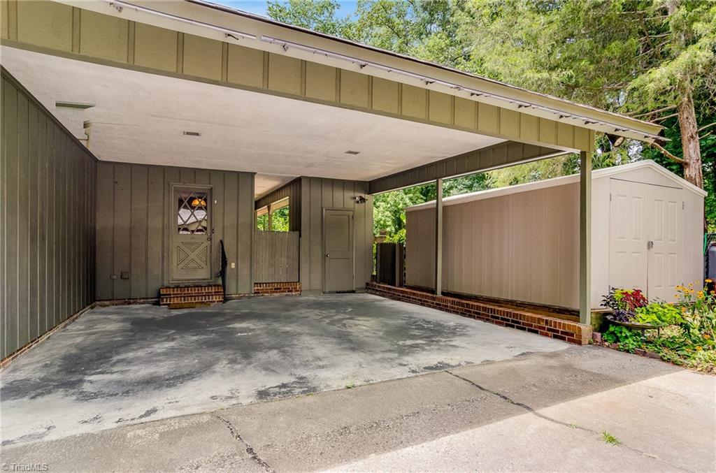 3105 Rolling Road High Point, NC 27265 - Photo 28 of 30 Two car carport with storage room plus 15'x10' storage building.