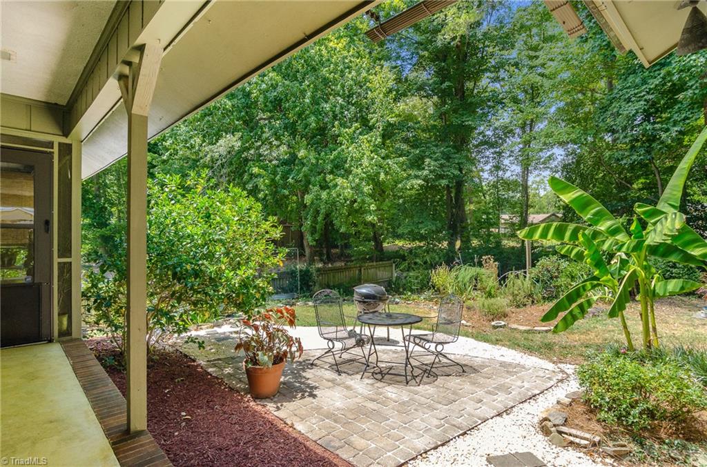 3105 Rolling Road High Point, NC 27265 - Photo 29 of 30 View from sliding glass doors in kitchen to patio area and backyard. What a glorious spot!