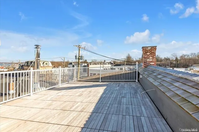a view of balcony with wooden floor