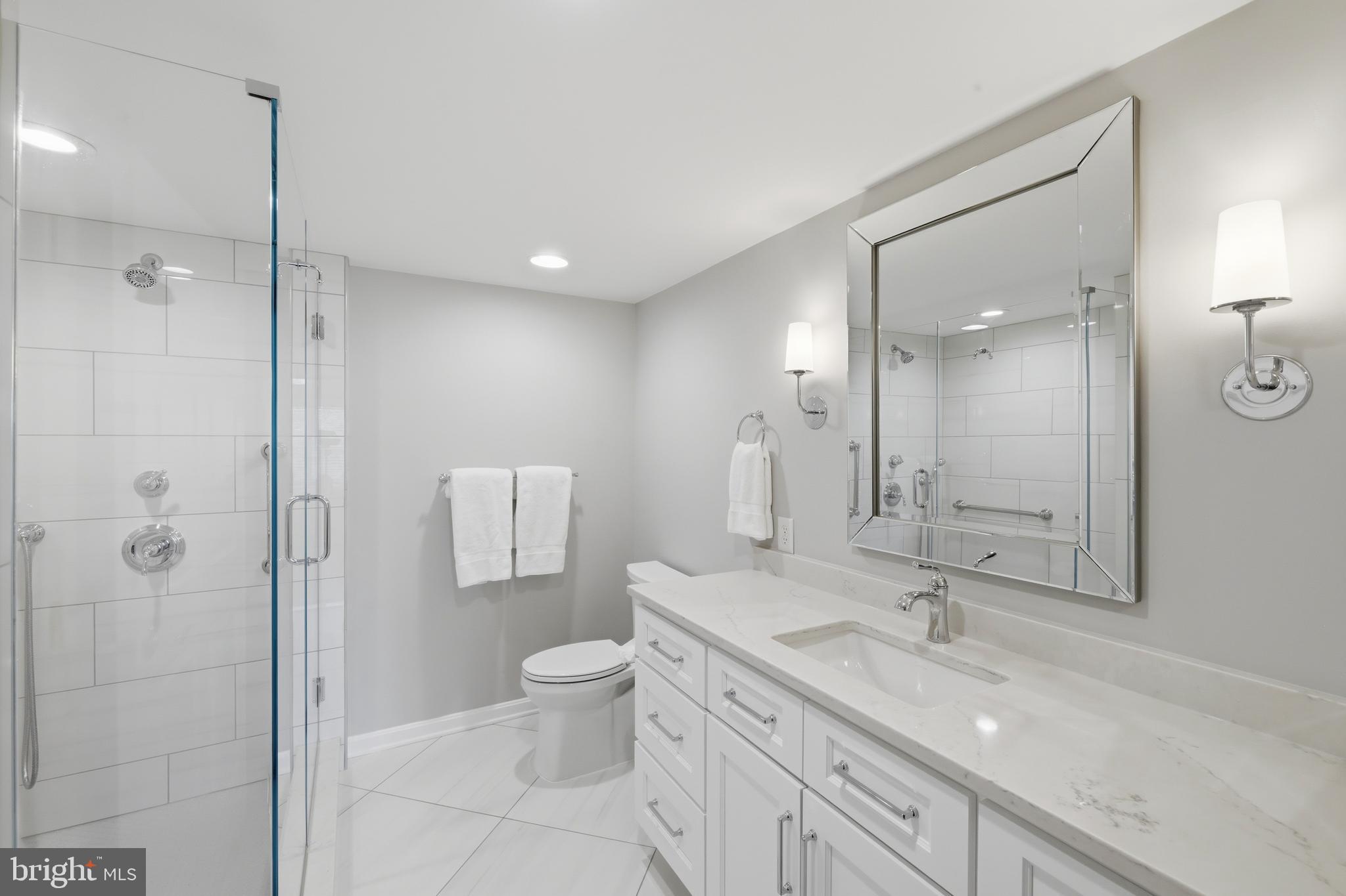 12240 Roundwood Road, Unit 605 Lutherville-Timonium, MD 21093 - Photo 15 of 38 Spacious primary en-suite bath with quarts vanity
