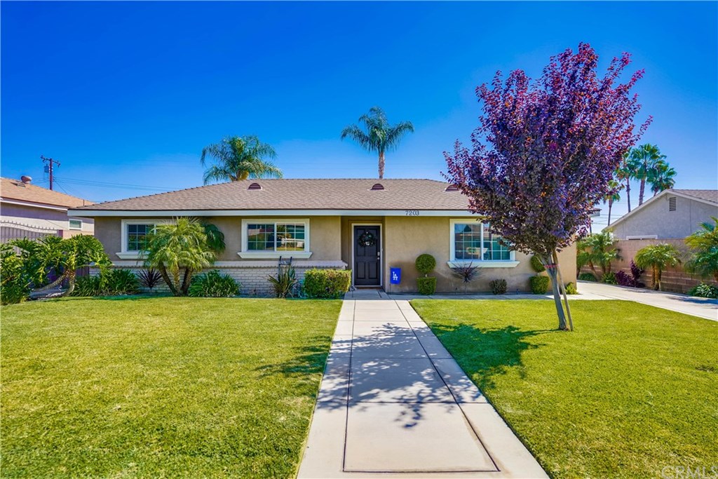 7203 Agate Street Rancho Cucamonga, CA 91701 - Photo 1 of 1 a front view of a house with garden