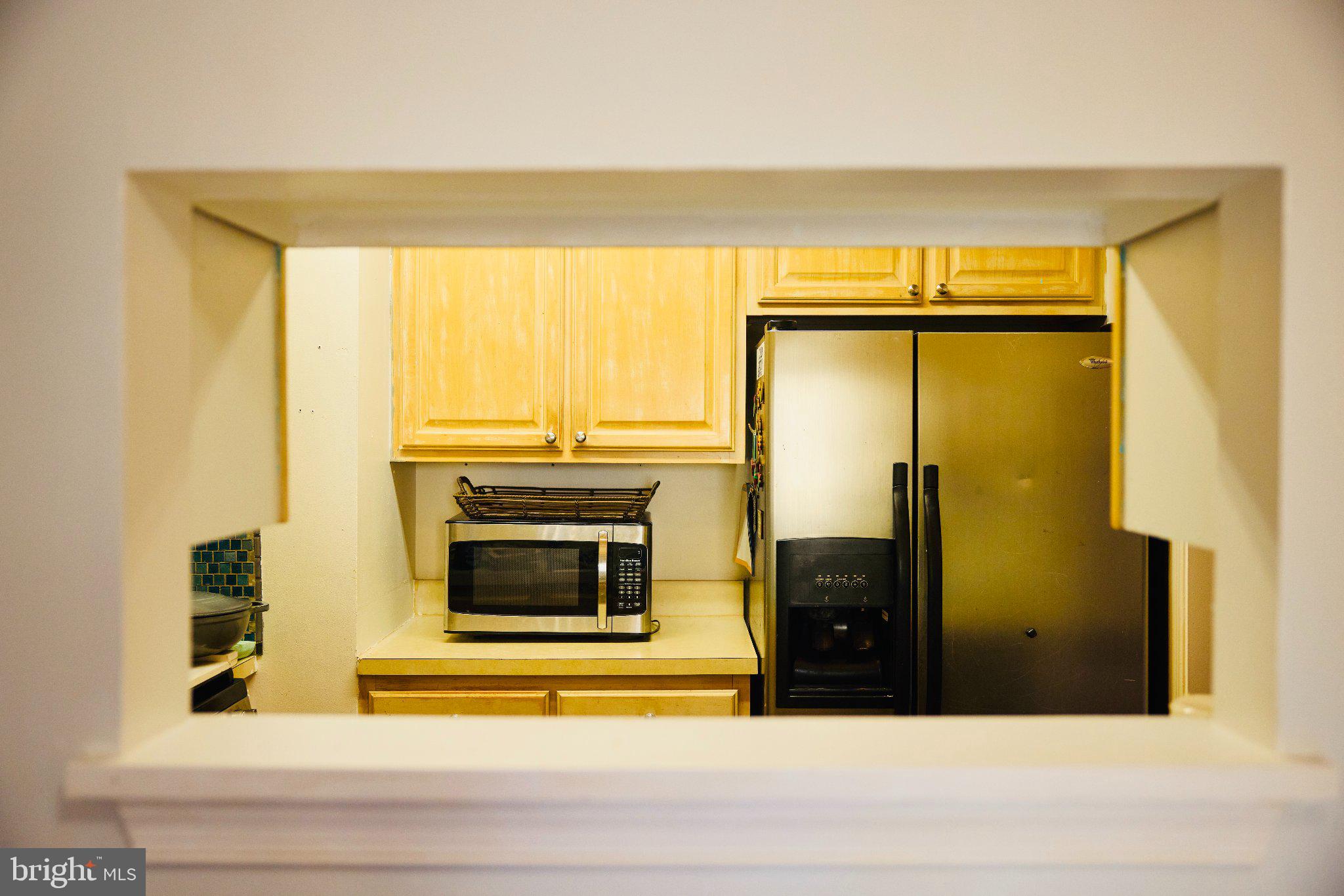 2710 Stanton Road Southeast Washington, DC 20020 - Photo 8 of 14 Charming kitchen view through a pass.
