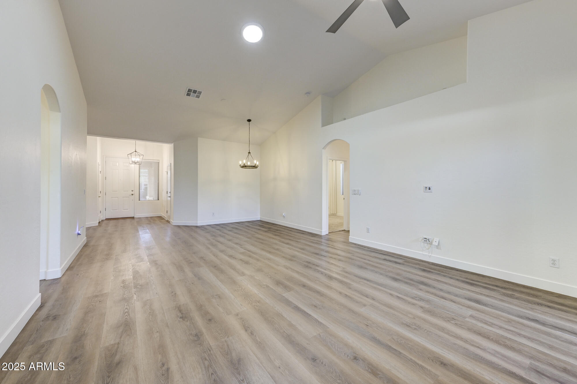 6646 East Rochelle Circle Mesa, AZ 85215 - Photo 10 of 43 wooden floor in an empty room with a window