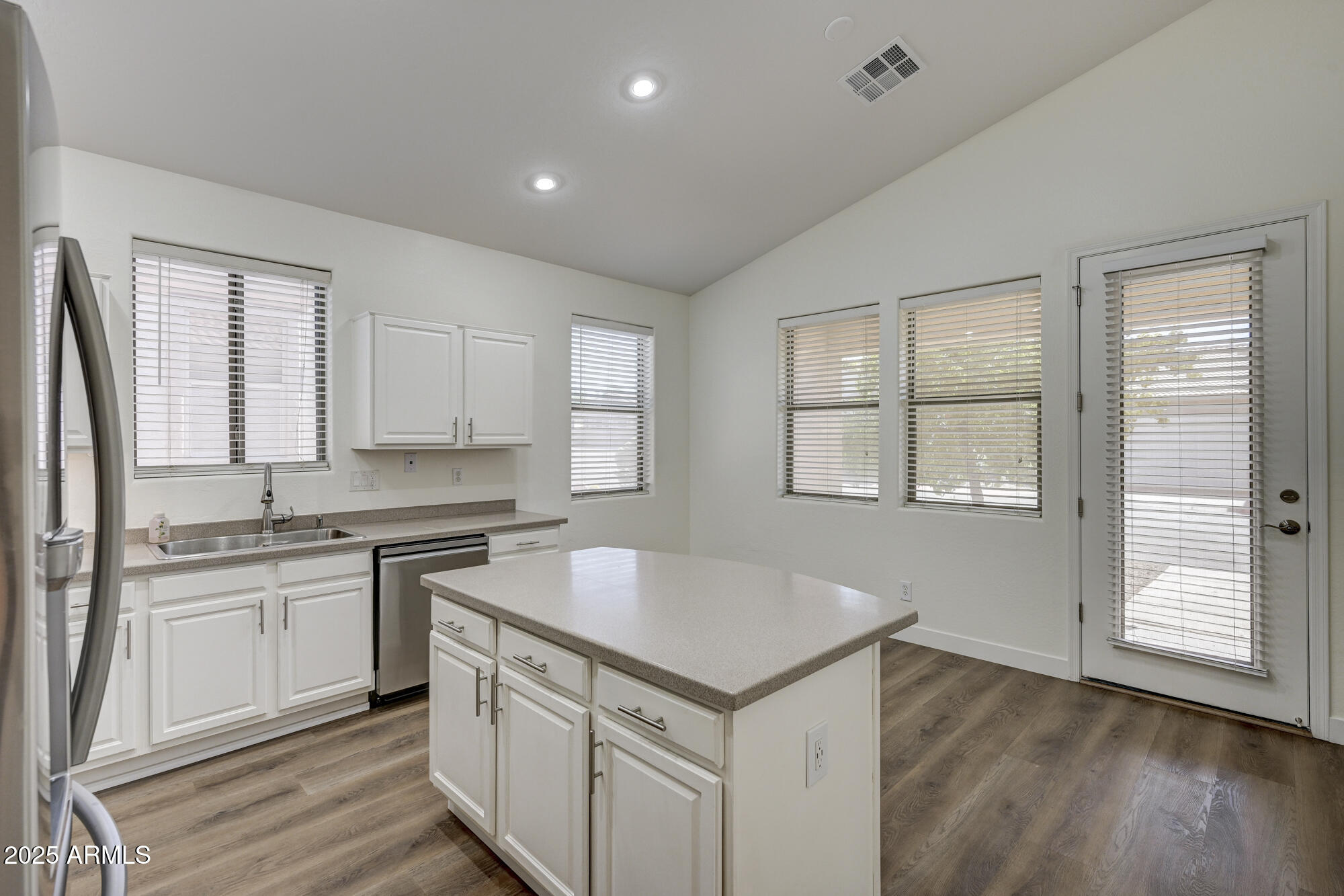6646 East Rochelle Circle Mesa, AZ 85215 - Photo 11 of 43 a kitchen with a sink stove and cabinets
