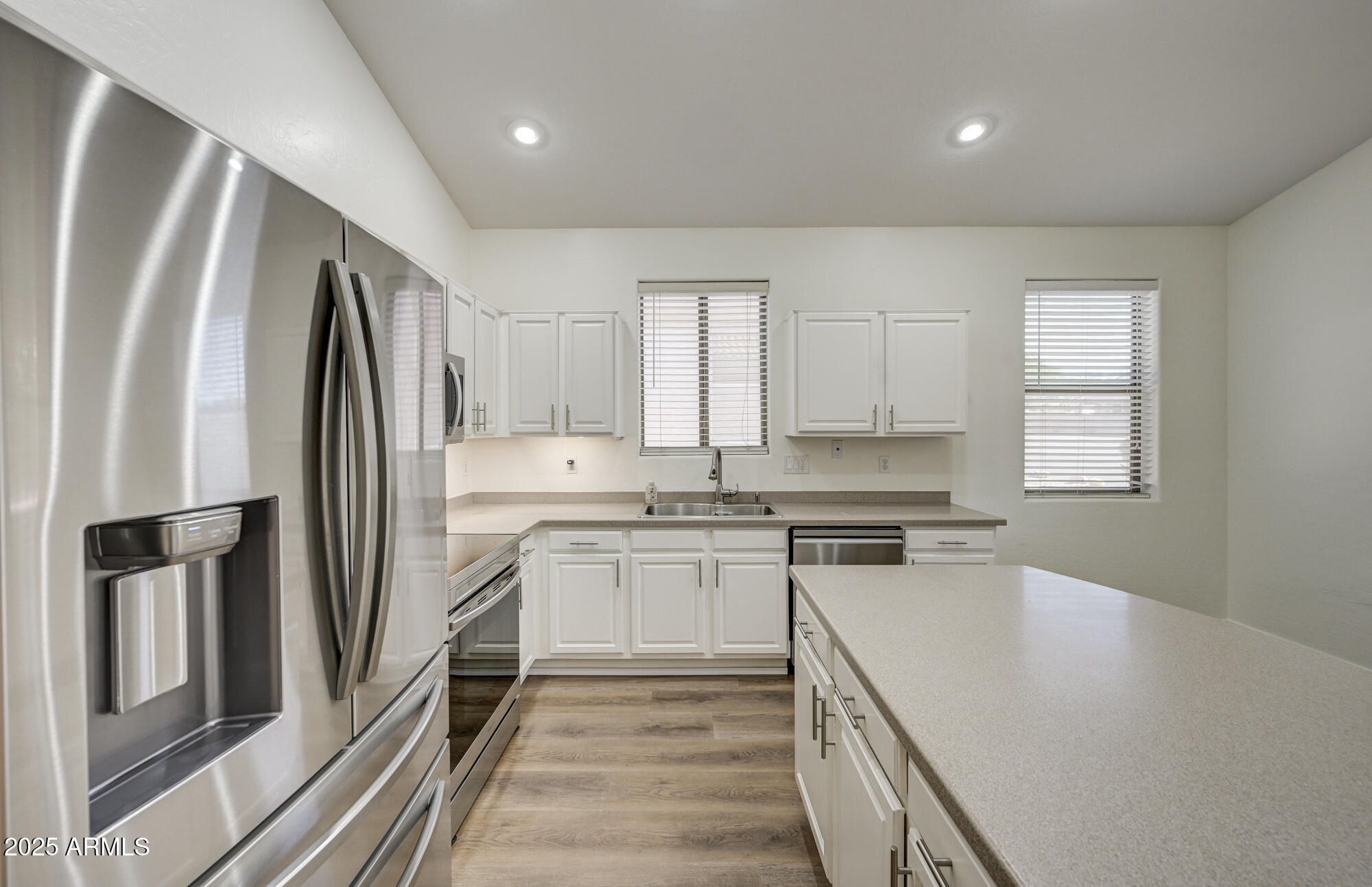 6646 East Rochelle Circle Mesa, AZ 85215 - Photo 12 of 43 a kitchen with a sink stove and refrigerator