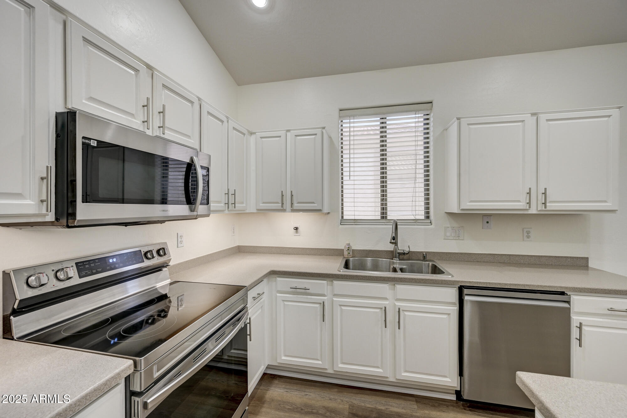 6646 East Rochelle Circle Mesa, AZ 85215 - Photo 13 of 43 a kitchen with a sink stove and microwave