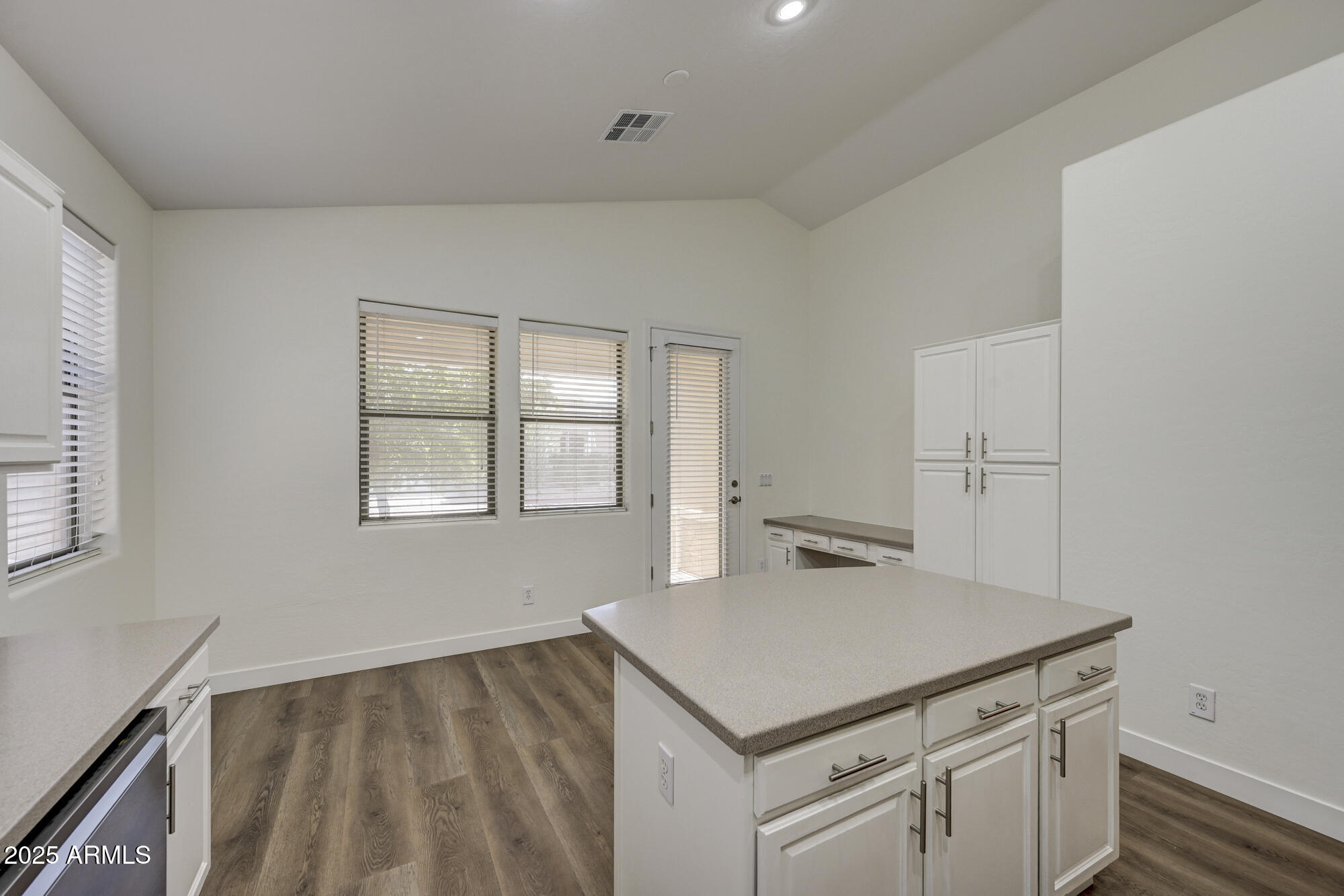 6646 East Rochelle Circle Mesa, AZ 85215 - Photo 18 of 43 a kitchen with a stove and a white cabinets