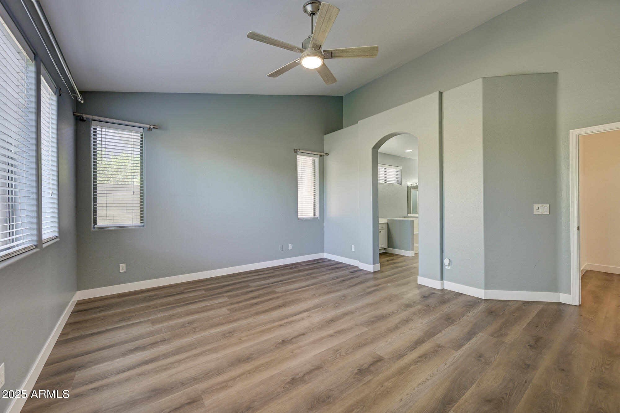 6646 East Rochelle Circle Mesa, AZ 85215 - Photo 20 of 43 a view of an empty room with window and wooden floor