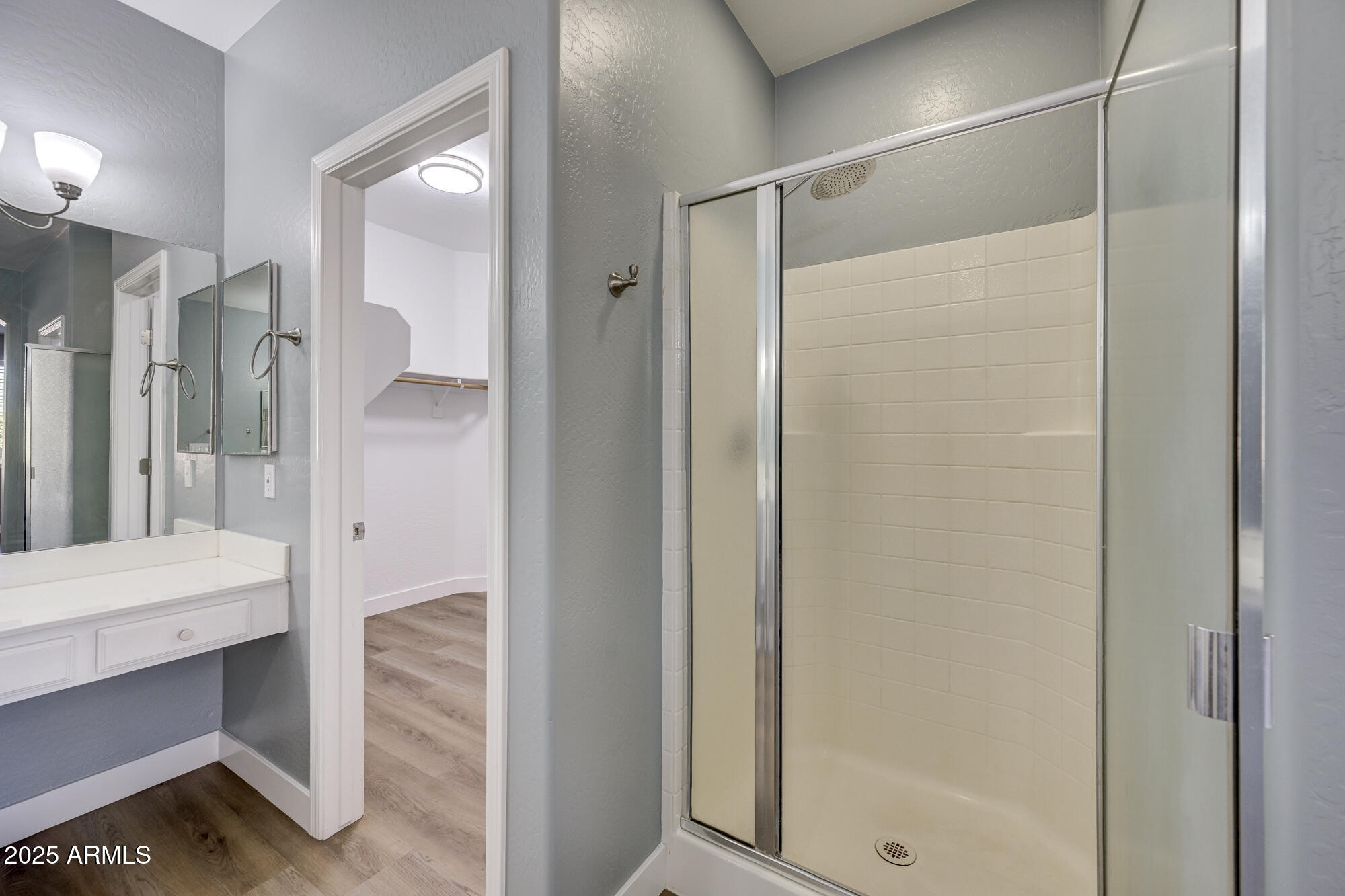 6646 East Rochelle Circle Mesa, AZ 85215 - Photo 24 of 43 a bathroom with a glass shower door