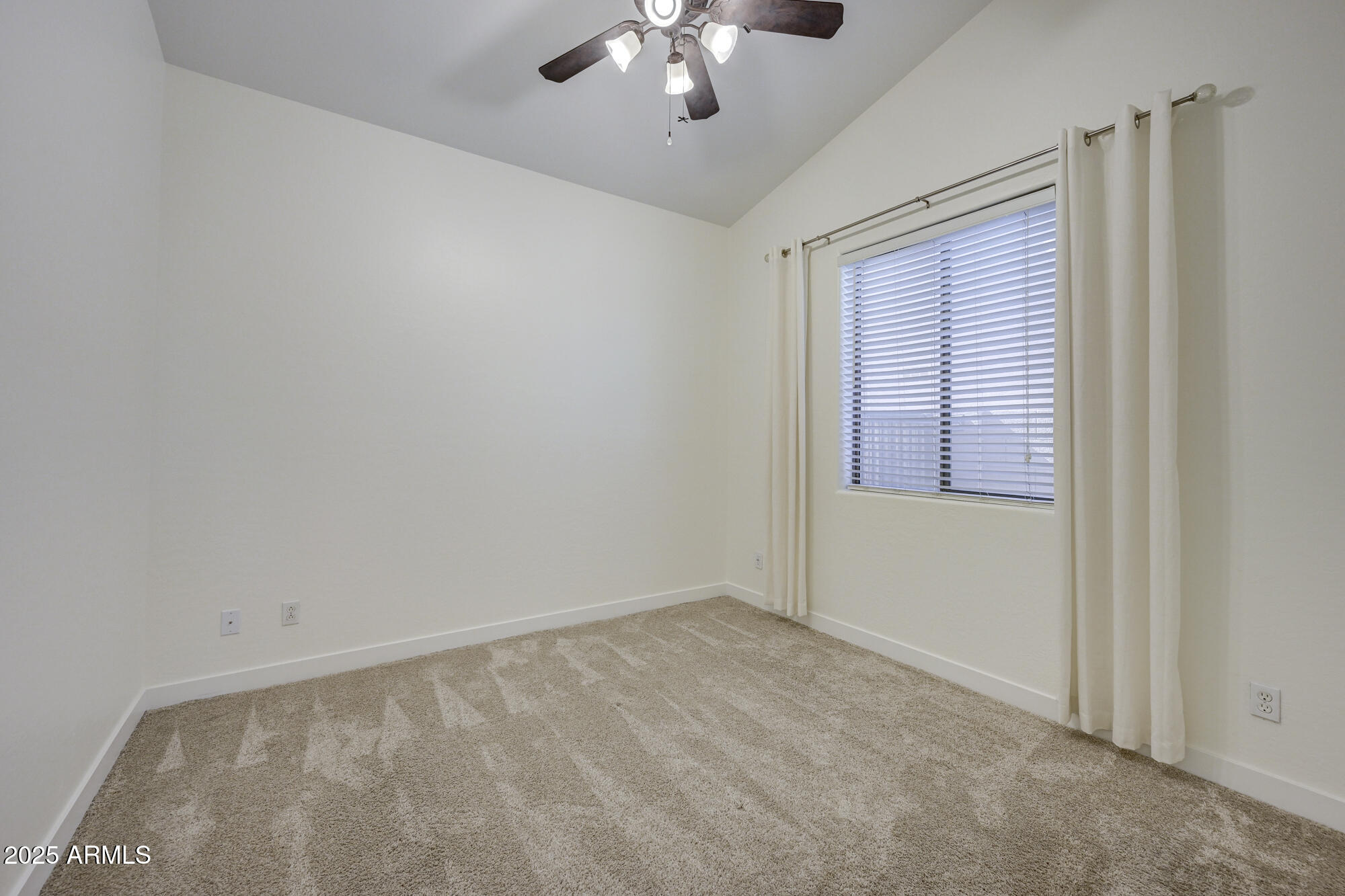 6646 East Rochelle Circle Mesa, AZ 85215 - Photo 26 of 43 a view of an empty room with a window