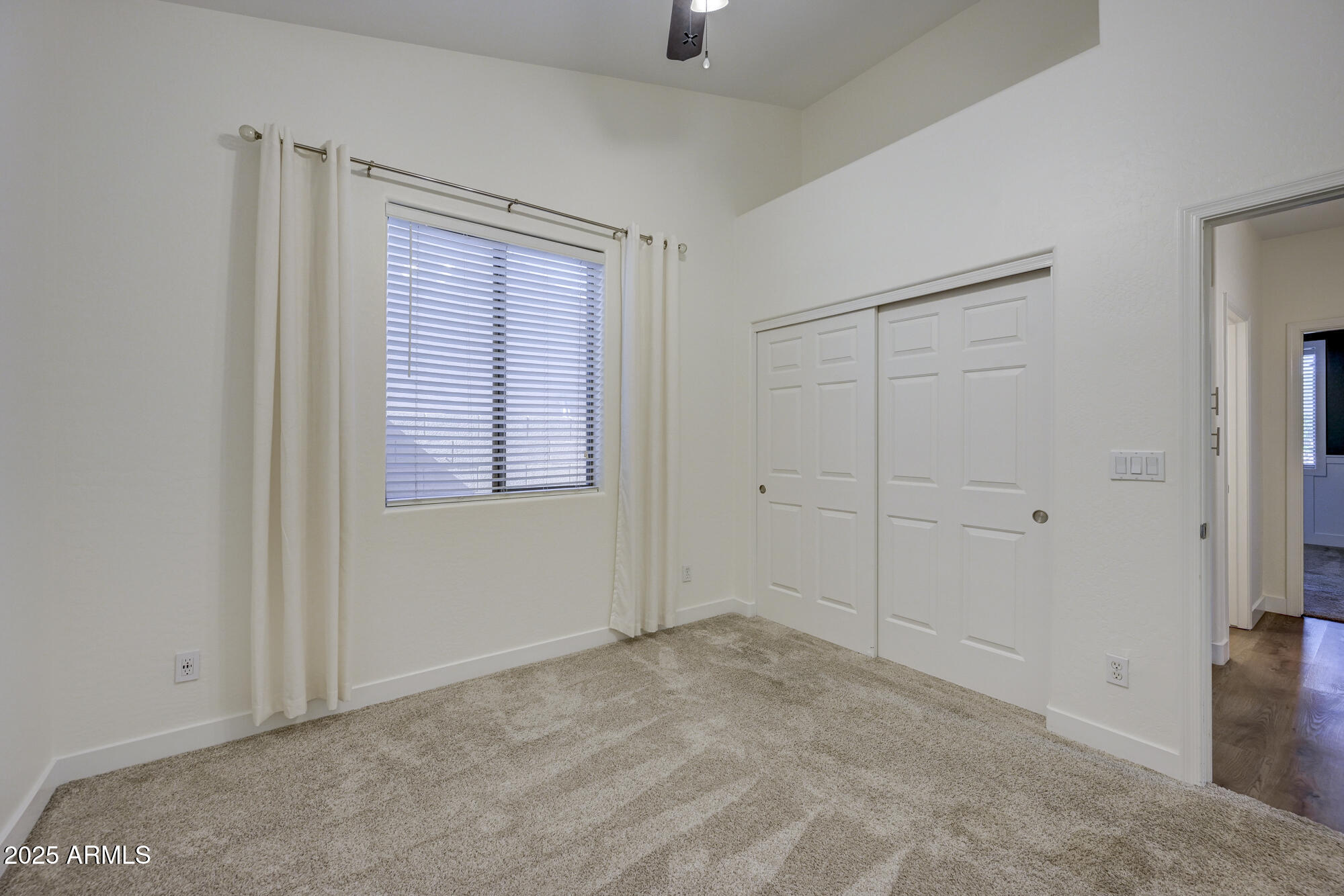 6646 East Rochelle Circle Mesa, AZ 85215 - Photo 27 of 43 a view of an empty room with windows and cabinet