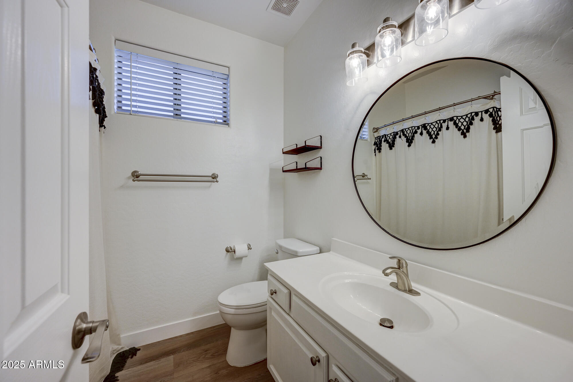 6646 East Rochelle Circle Mesa, AZ 85215 - Photo 28 of 43 a bathroom with a sink and a mirror