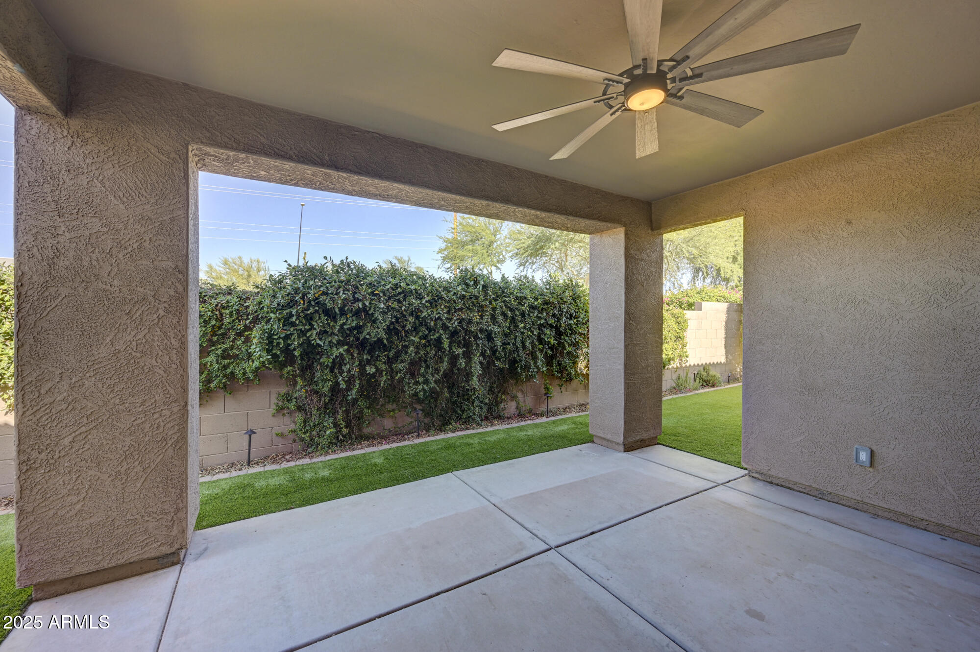 6646 East Rochelle Circle Mesa, AZ 85215 - Photo 34 of 43 a view of a porch in front of a house with a garden
