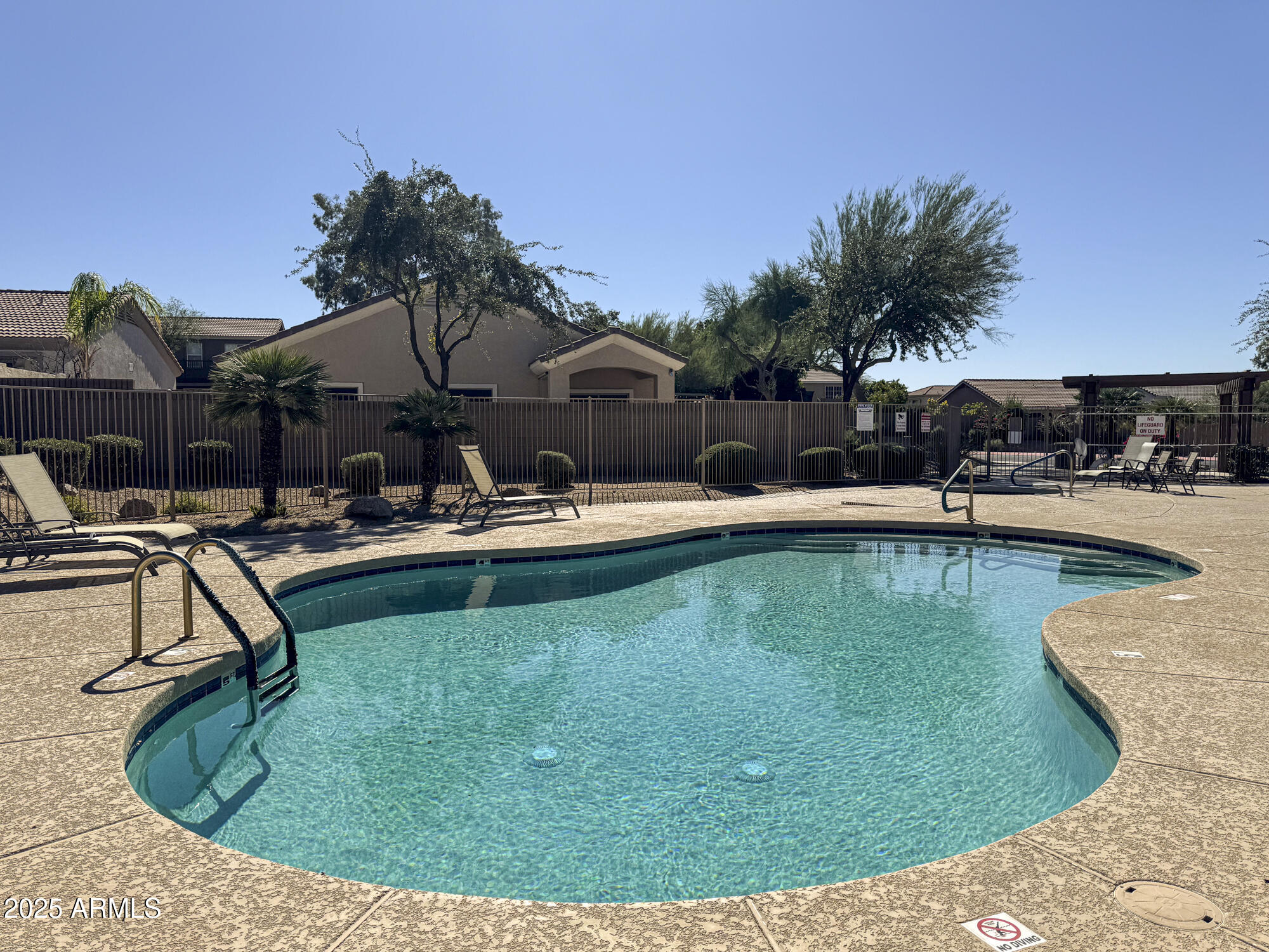 6646 East Rochelle Circle Mesa, AZ 85215 - Photo 40 of 43 a swimming pool with outdoor seating and yard