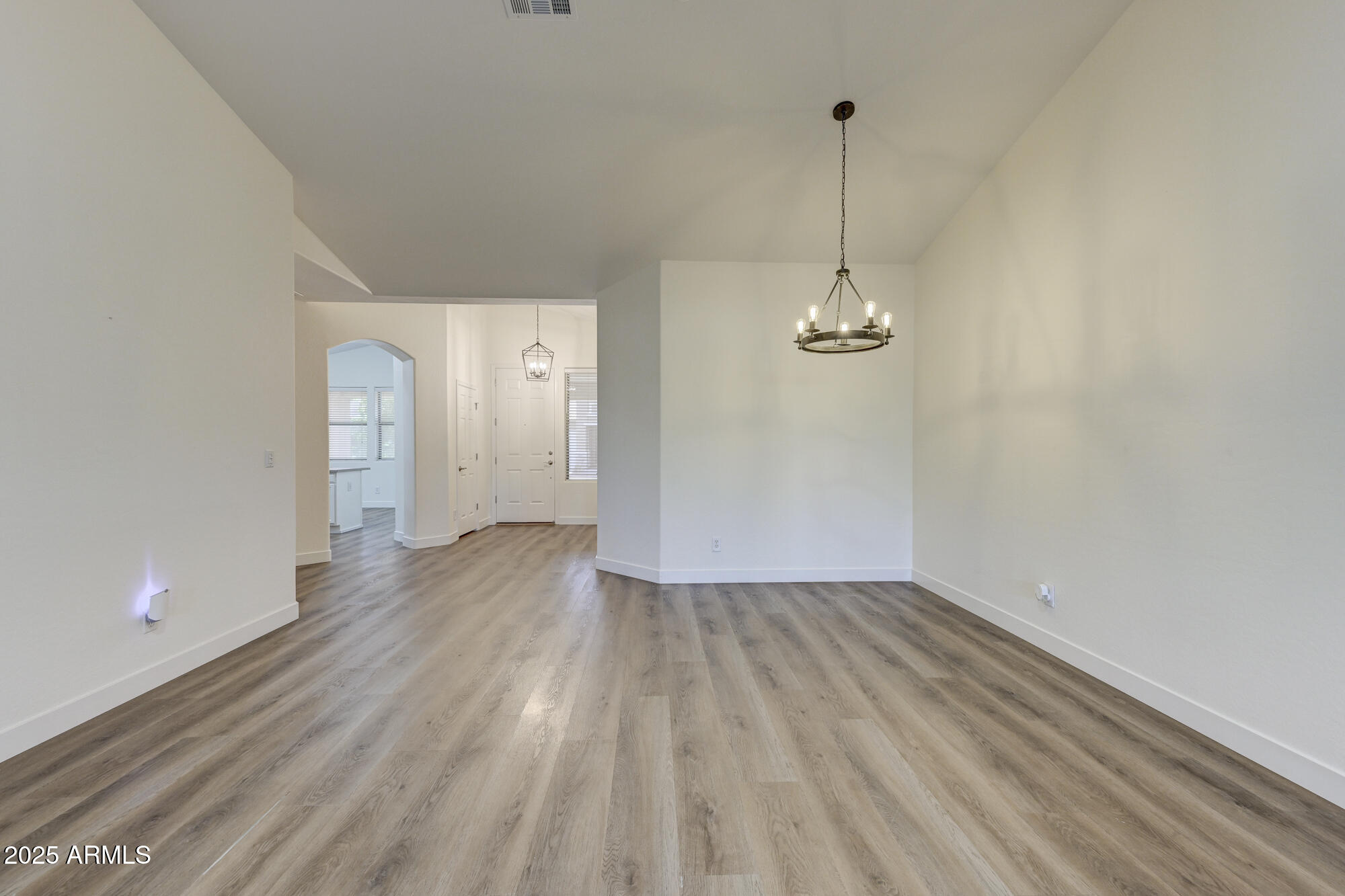 6646 East Rochelle Circle Mesa, AZ 85215 - Photo 8 of 43 a view of a room with wooden floor and ceiling fan