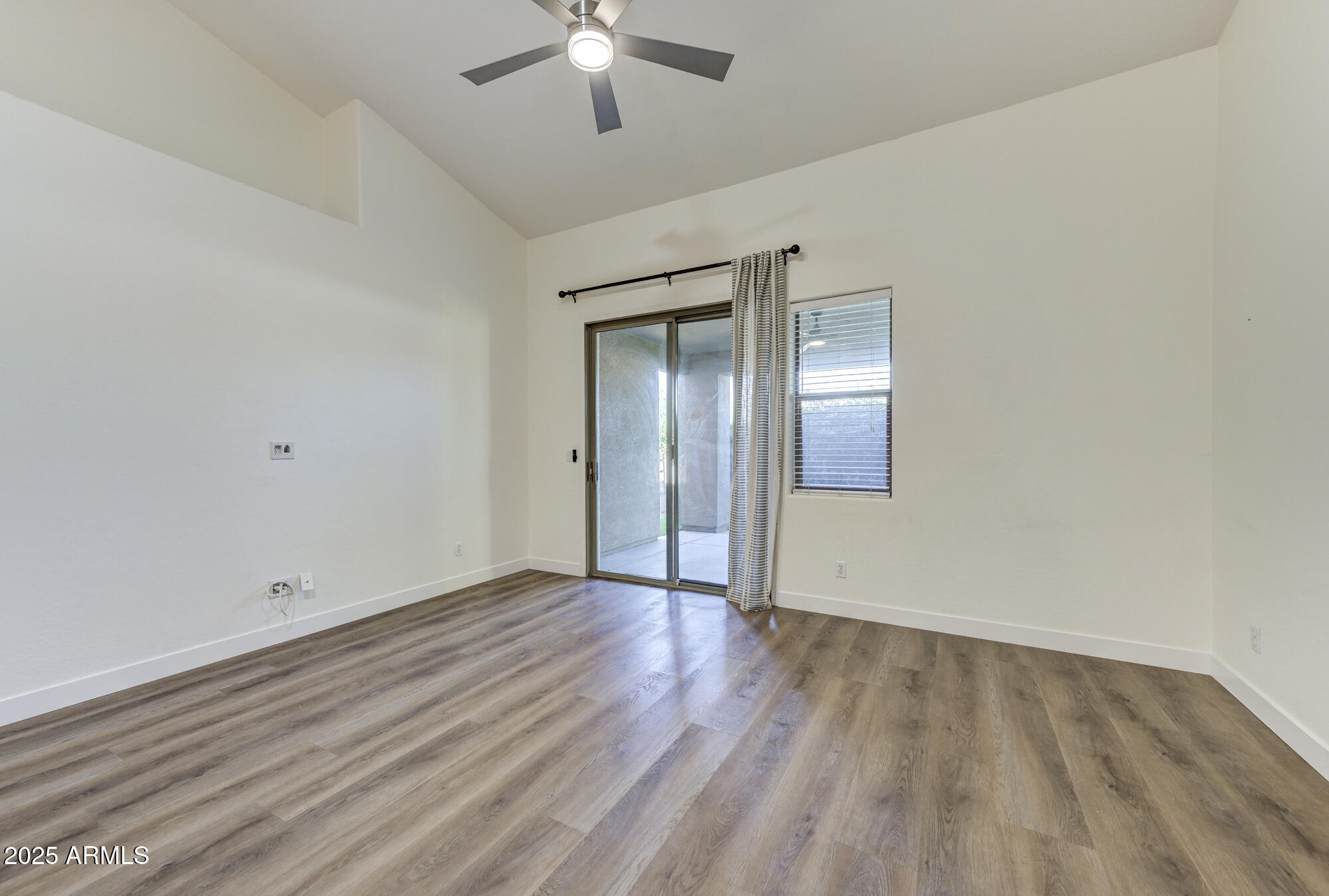 6646 East Rochelle Circle Mesa, AZ 85215 - Photo 9 of 43 a view of an empty room with wooden floor