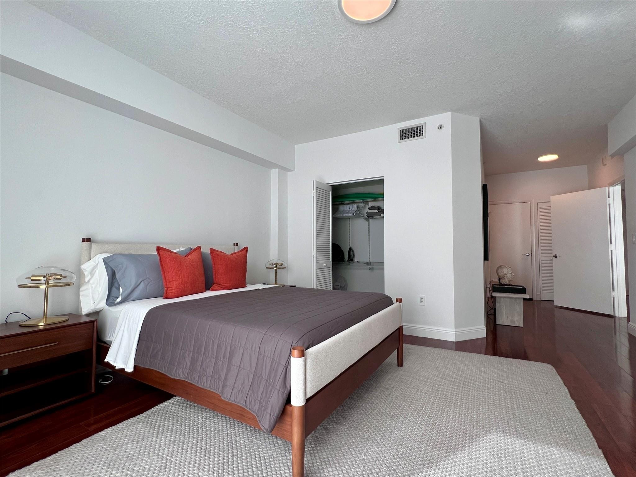 7275 Southwest 90th Way, Unit 603 Miami, FL 33156 - Photo 12 of 19 a bedroom with a bed and a table