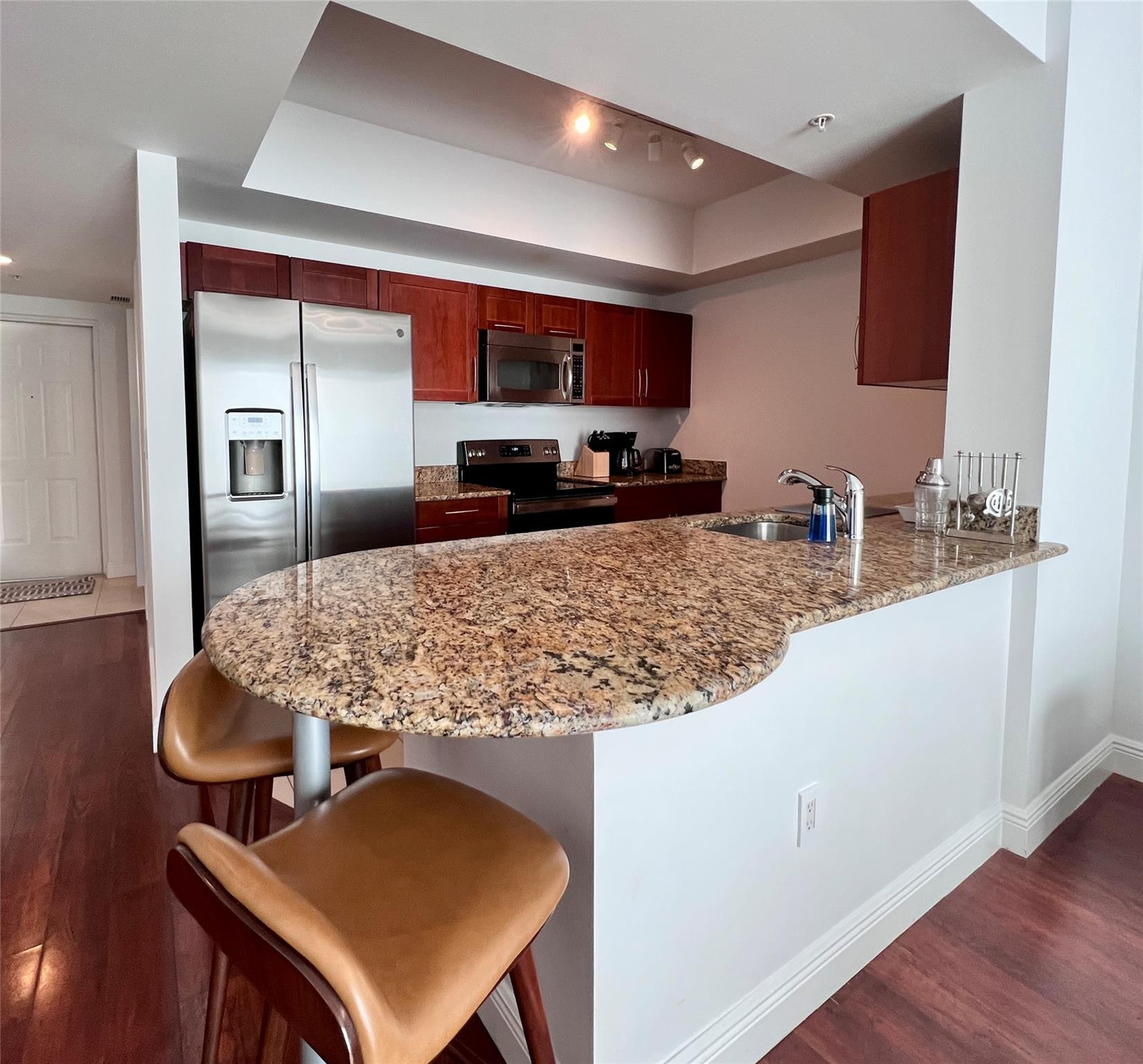 7275 Southwest 90th Way, Unit 603 Miami, FL 33156 - Photo 4 of 19 a kitchen with a table and chairs in it