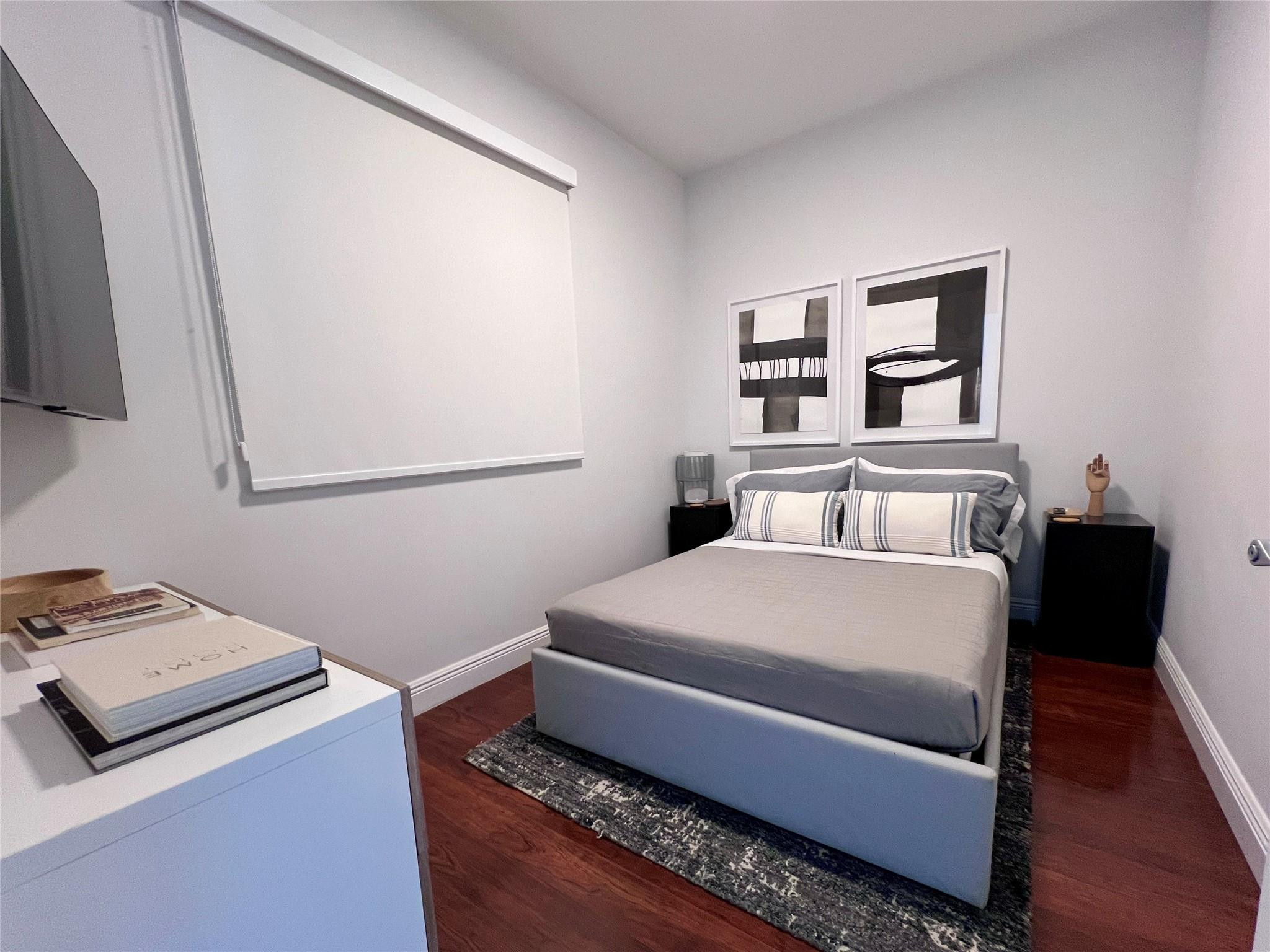 7275 Southwest 90th Way, Unit 603 Miami, FL 33156 - Photo 7 of 19 a bedroom with a bed and a night stand