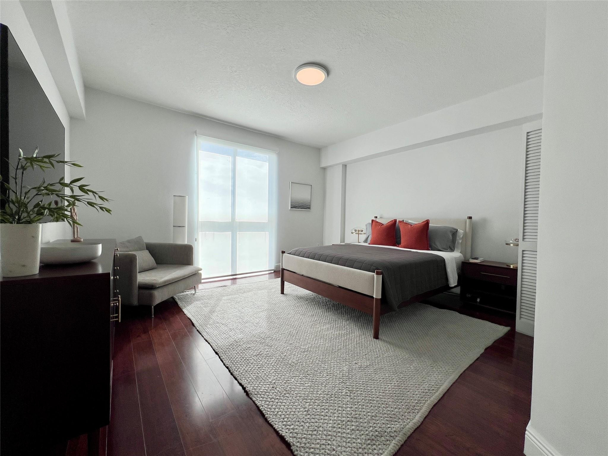 7275 Southwest 90th Way, Unit 603 Miami, FL 33156 - Photo 10 of 19 a bedroom with a bed couch and a window