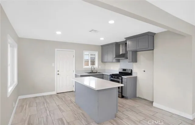 a kitchen with stainless steel appliances granite countertop a sink and cabinets