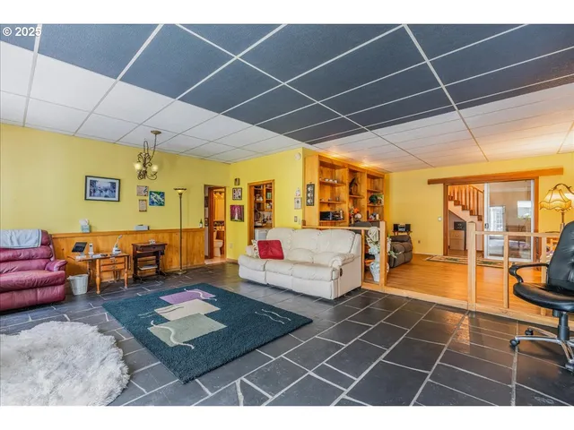 a living room with furniture and a table