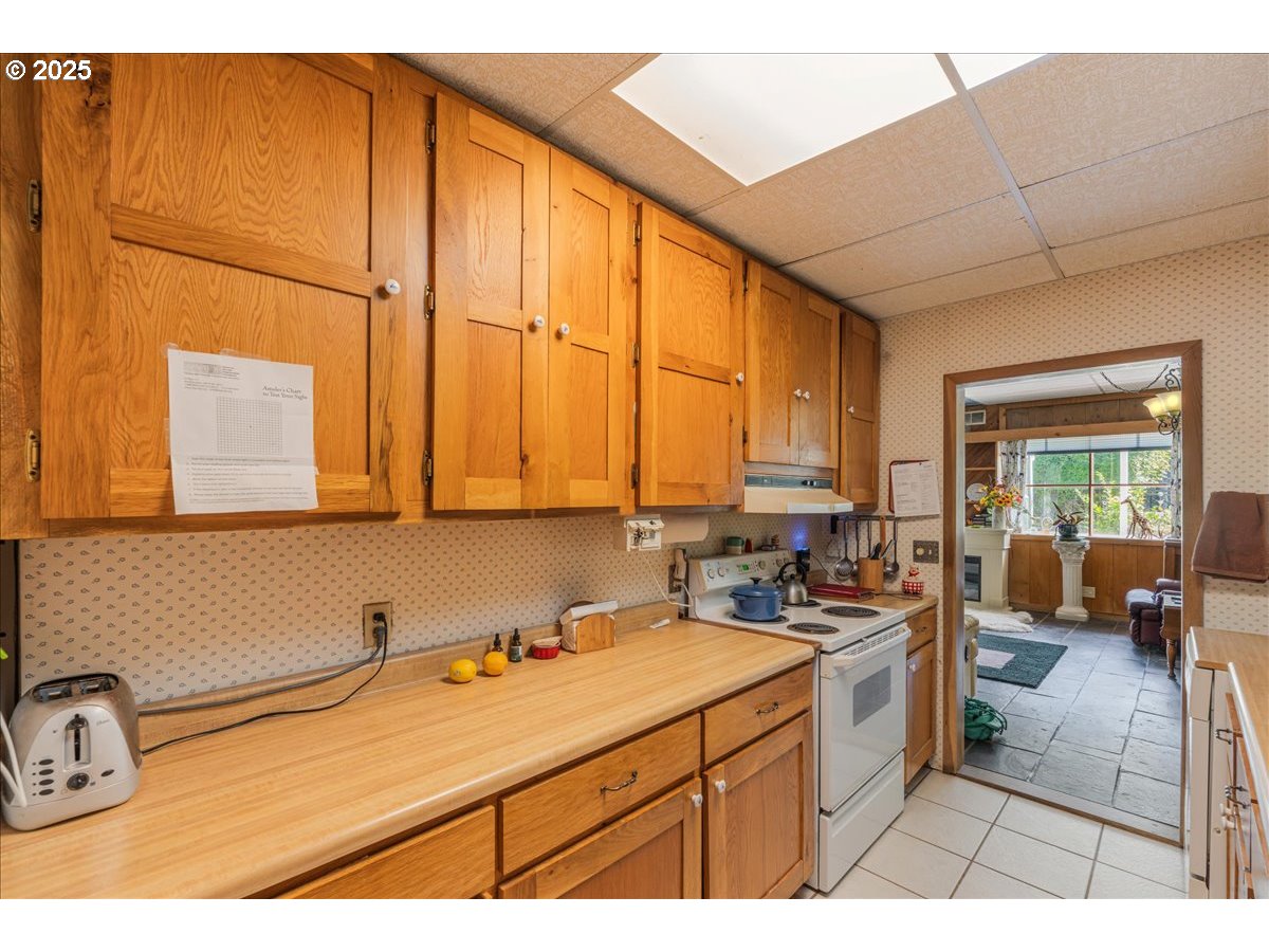 18175 Northeast Bald Peak Road Newberg, OR 97132 - Photo 14 of 41 a kitchen with a sink and cabinets