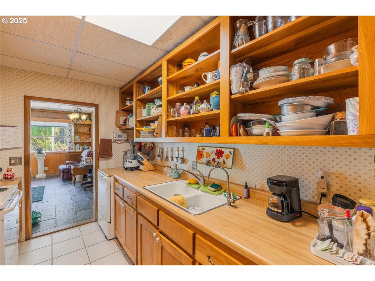18175 Northeast Bald Peak Road Newberg, OR 97132 - Photo 15 of 41 a kitchen with a sink and cabinets